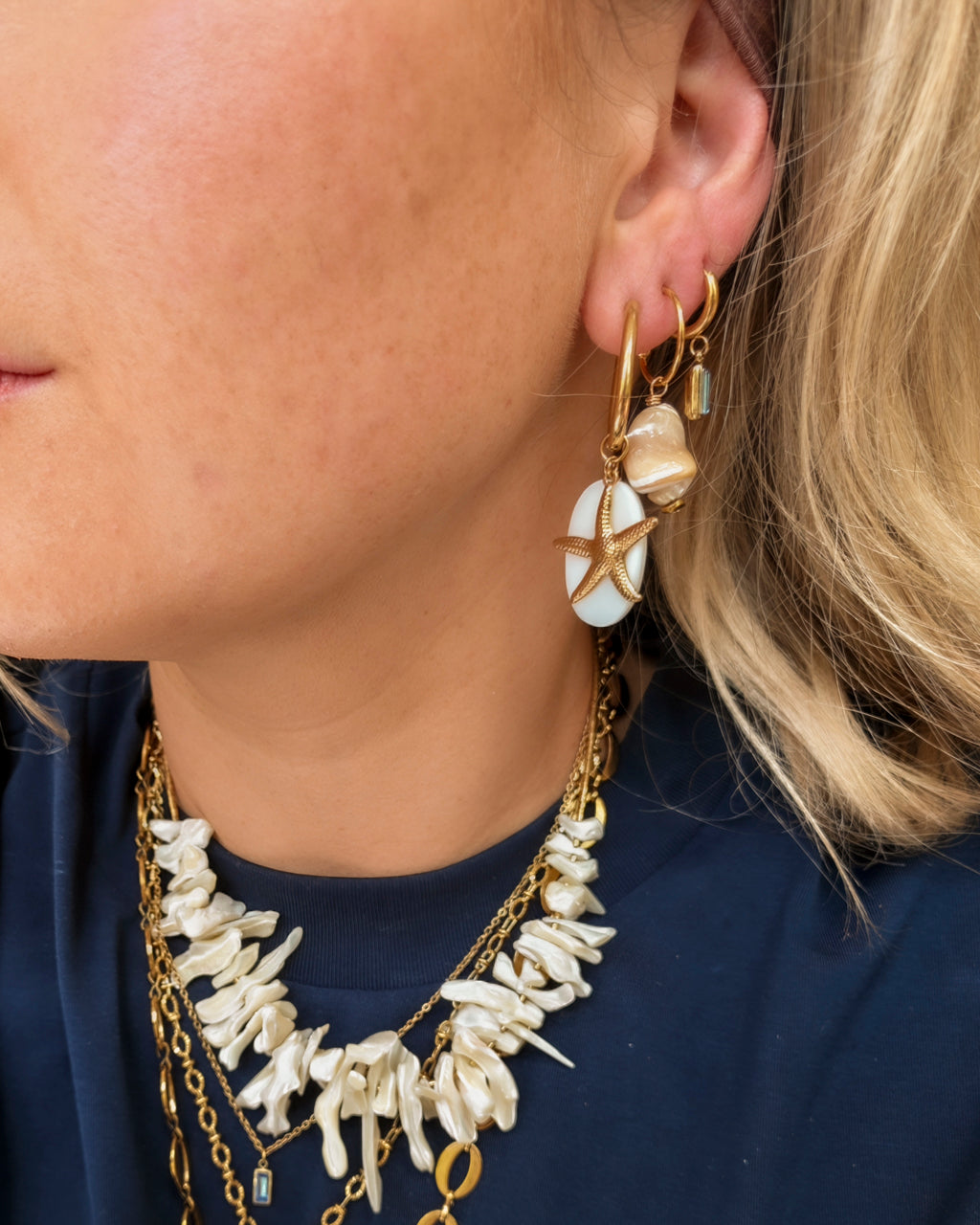 Oorbellen Coastal Treasures Shell & Seastar op model